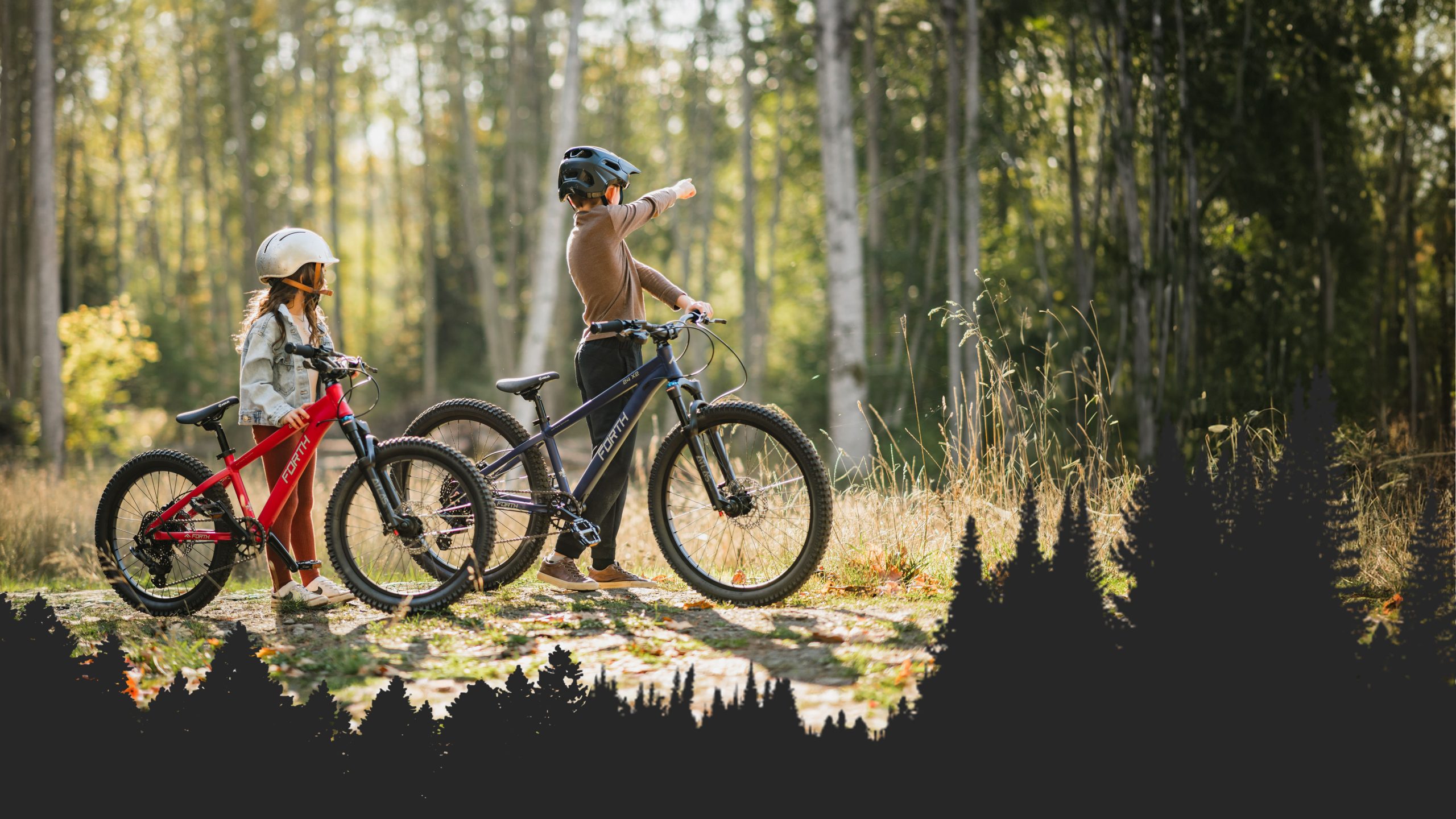 kids in forest with bikes having an adventure